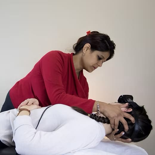Roopali Neemuchwala performing a vestibular treatment manoeuvre